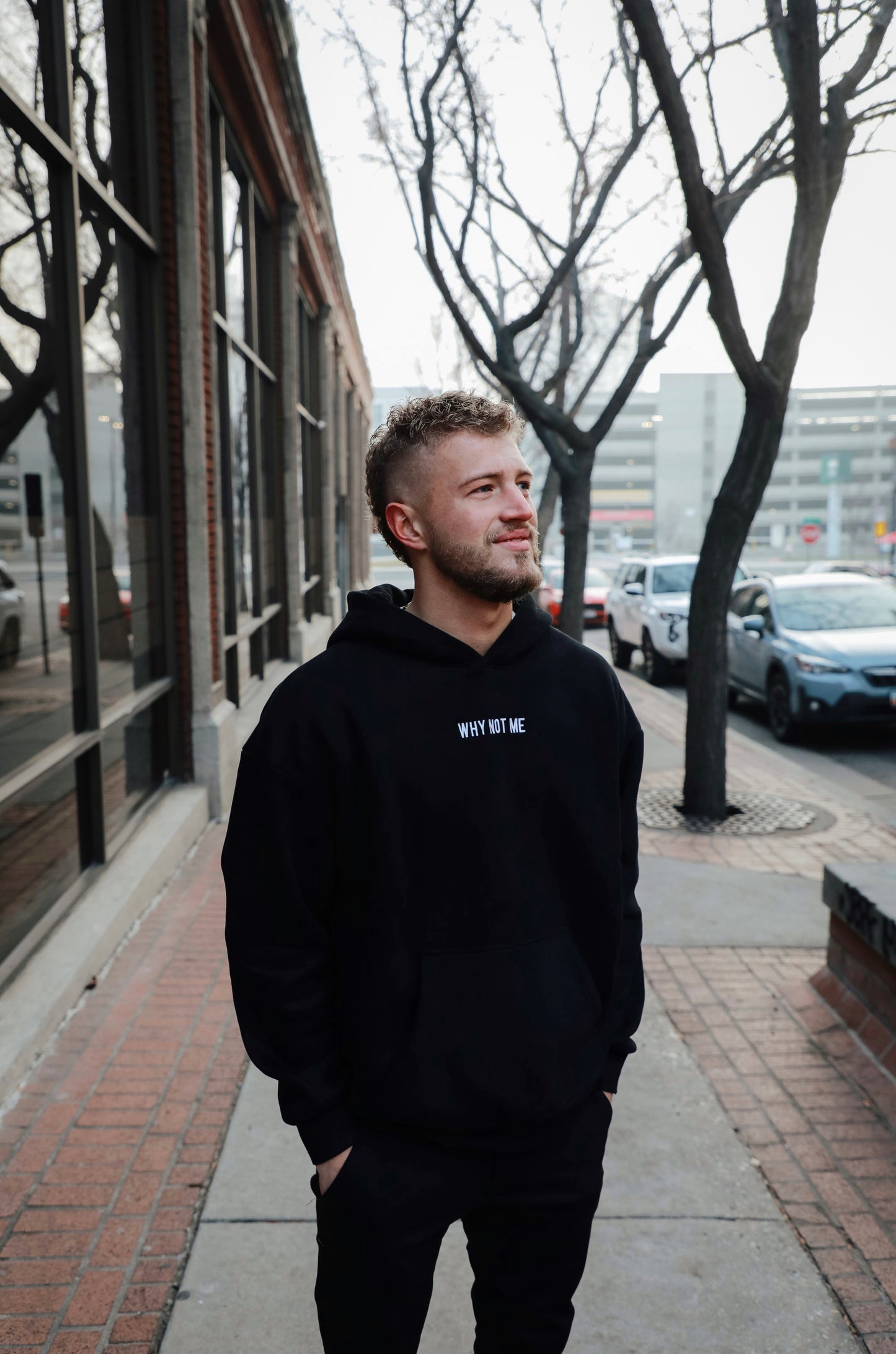 THE RESET hoodie worn on the street, boxy fit shown three-quarter